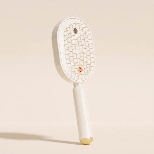 The Ivresse Mist and Glow Brush in beige, showing the cream bristles and champagne gold handle tip.