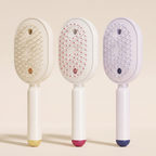 The Ivresse Mist and Glow Brush in all three colours, beige, pink and purple, side by side.
